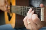 Guitarist Hand Playing Acoustic Guitar Stock Photo