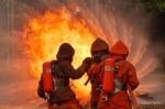 Firefighters Fighting Stock Photo