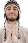 Young Guy Praying With Joined Hands Stock Photo
