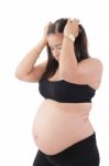 A Young Pregnant Woman Is Experiencing The Discomfort Of Pregnan Stock Photo