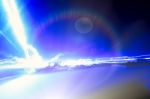 Horizontal Vivid Lightning With Flare Background Stock Photo