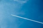 Jet Airplane With Trail Of Fuel Stock Photo