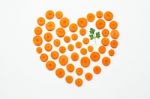 Chopped Carrot Slices Heart Shape And Parsley Leaves Stock Photo
