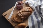 Dark Multigrain Bread Whole Grain And Jam Fresh Baked On Rustic Closeup Stock Photo