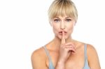 Attractive Middle Aged Woman Gesturing Silence Stock Photo
