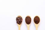 Wooden Spoons Filled With Coffee Bean And Crushed Ground Coffee Stock Photo