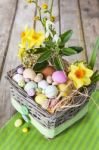 Easter Eggs In The Basket On Green Striped Cloth Stock Photo