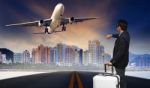 Man With Big Luggage Standing On Raod And Watching To Airplane F Stock Photo