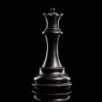 Black And White Queen Of Chess Setup On Dark Background . Leader Stock Photo