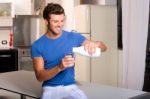 Man Pouring Milk Stock Photo