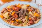 Brown Beans With Meat And Carrot Stock Photo