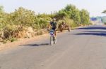 Cyclist On The Road In Ethiopia Stock Photo