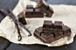 Chunks Of Dark Chocolate Bar And Vanilla Beans Stock Photo