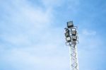 Spotlights Electric Poles With Blue Sky For Background Stock Photo