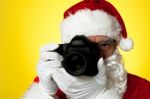 Aged Santa Adjusting Camera Lens Before Click Stock Photo