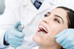 Female Getting Her Teeth Examined Stock Photo