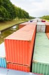 Containers On  Ship In River Stock Photo