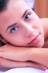 Young Woman Laying On Massage Bed Stock Photo