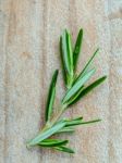 Branch Of Fresh Rosemary  On Shabby Wooden Background With Flat Stock Photo
