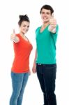 Teenage Couples Showing Thumbs Up Stock Photo