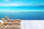 Beach Lounge, Sundeck Over Blue Sea And Sky, Summer Holiday Vacation Concept Stock Photo
