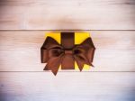 Gift Box On The Wooden Board Stock Photo