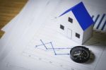 House Model And Compass On Plan Background, Real Estate Concept Stock Photo