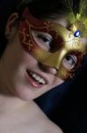 The Beautiful Young Girl In A Mask Stock Photo