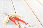 Red Chillies Pepper On The White Wooden Floor Stock Photo