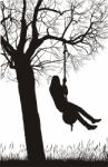 Girl Swinging From Tree Stock Photo
