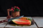 Papaya And Knife On Wooden Stock Photo