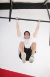 Fit Man Performing Pull Ups In Bar Stock Photo