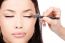 Applying Cosmetic Pencil On Eye