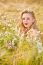 Blond Girl On The Camomile Field