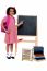 Pretty Schoolgirl Pointing At Chalkboard
