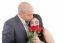 Woman Enjoys The Smell Given Of A Bouquet Of Roses. Happy Couple