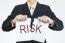 Businessman Tearing Sheet Paper, Risk Management Concept