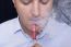 Men Smoke An Electronic Cigarette