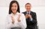 Close-up Of Smiling Businesspeople Clapping