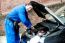 Young Mechanic Inspecting  Car Parts