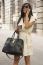 Stylish Young Business Woman With Bag And Coffee Laughs Into Pho