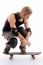 American Male Sitting On Skateboard