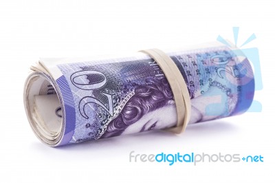 20 Pounds Banknotes Rolled Up And Tightened With Rubber Band On Stock Photo