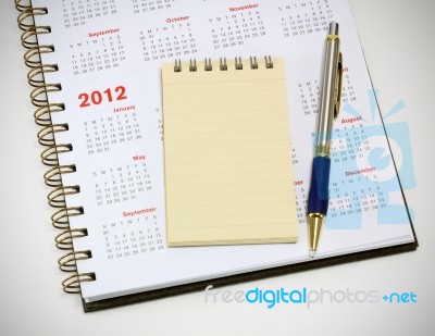 2012 Calendar Notebook And Pen Stock Photo