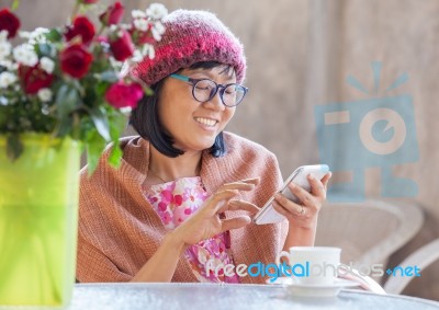 40s Years Woman Happiness Emotion Looking Message On Smart Phone  With Relaxation Use For People Digital Lifestyle Stock Photo