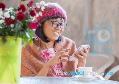 40s Years Woman Happiness Emotion Looking Message On Smart Phone  With Relaxation Use For People Digital Lifestyle Stock Photo