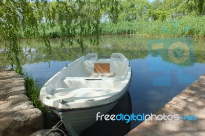 A Bridge And Boats  On The Lake Stock Photo