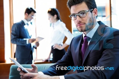 A Business Team Of Three In Office And Planning Work Stock Photo