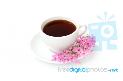 A Cup Of Black Coffee With Flowers Stock Photo