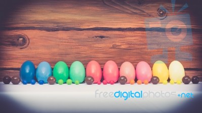 A Few Colorful Easter Eggs With Candies And Chocolate Over Wood Background Happy Easter Stock Photo A Few Colorful Easter Eggs With Candies And Chocolate Over Wood Background Happy Easter Stock Photo
